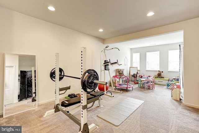 exercise area with baseboards, carpet flooring, and recessed lighting