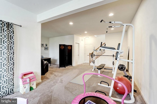 exercise area featuring baseboards, carpet, and recessed lighting