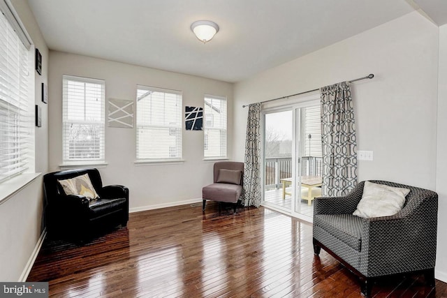 sitting room featuring a wealth of natural light, baseboards, and hardwood / wood-style floors