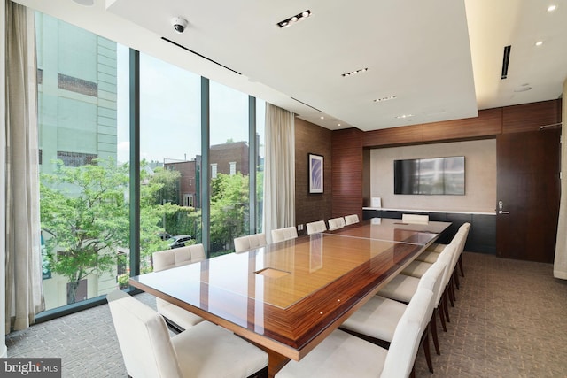 dining area with floor to ceiling windows and recessed lighting