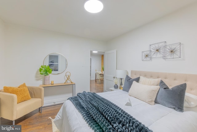 bedroom featuring wood finished floors