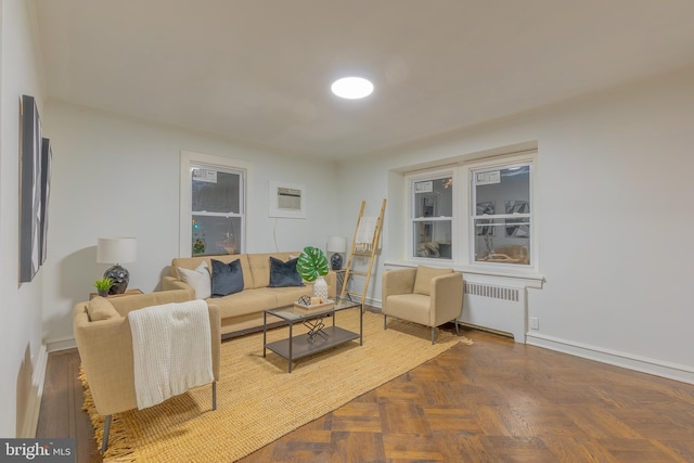 living area with radiator and baseboards