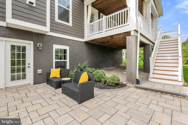 view of patio / terrace featuring stairs