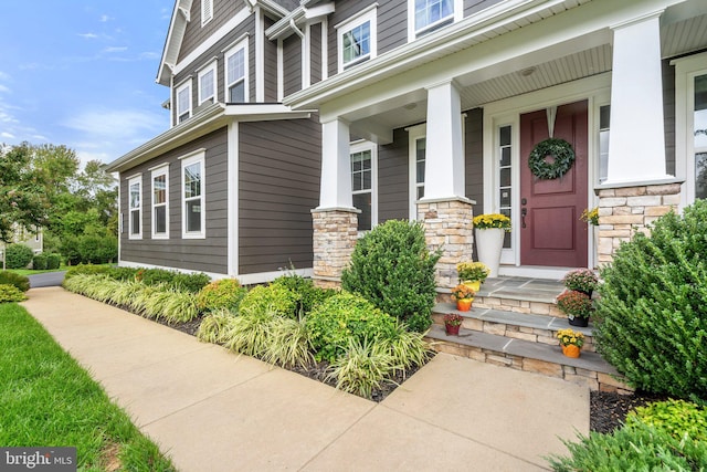 view of exterior entry featuring stone siding