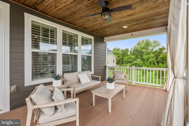 deck featuring a porch and a ceiling fan