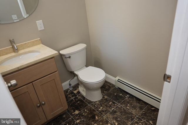 half bathroom with a baseboard radiator, baseboards, toilet, and vanity