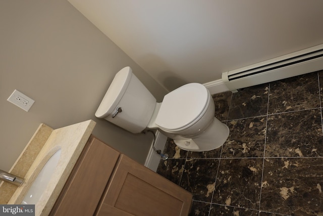 bathroom featuring toilet and a baseboard radiator