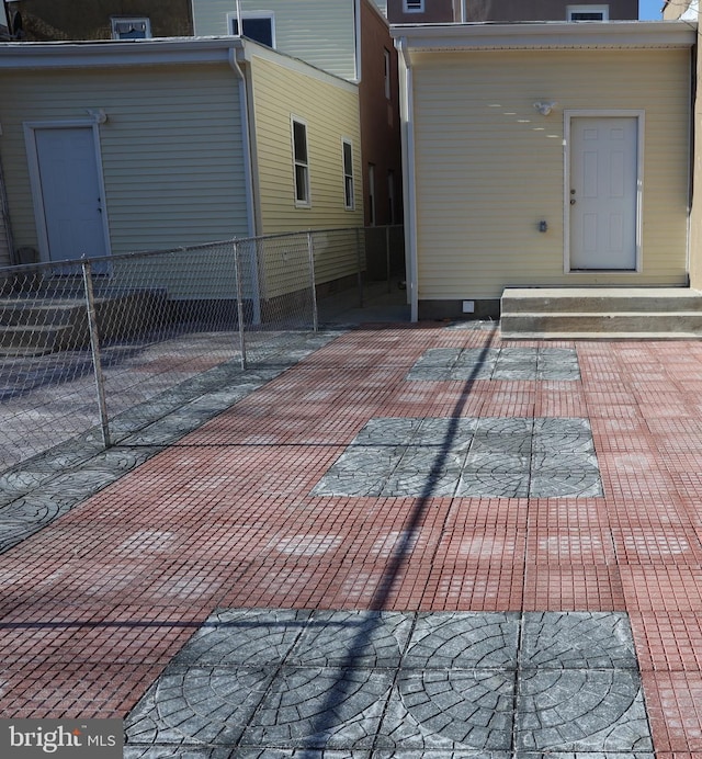 view of patio / terrace with entry steps and fence