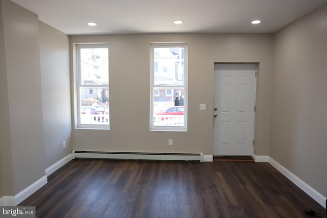 foyer with recessed lighting, dark wood-style floors, baseboards, and baseboard heating