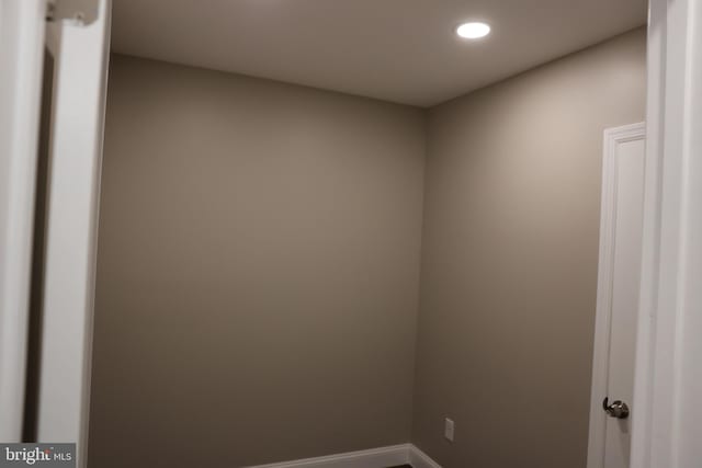 unfurnished room with recessed lighting