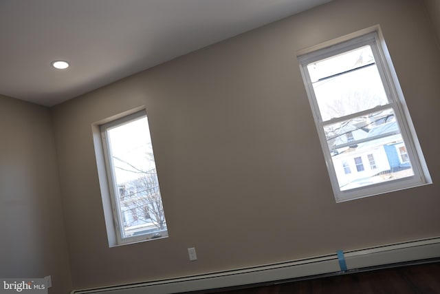 room details featuring recessed lighting and a baseboard radiator