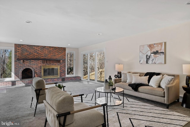 living room with a fireplace, carpet flooring, and recessed lighting