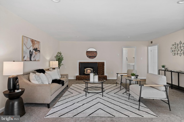 living room featuring carpet floors, a brick fireplace, and baseboards