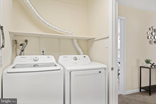 laundry room with laundry area, washer and clothes dryer, carpet flooring, and baseboards