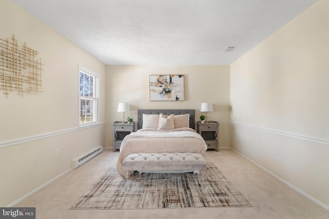 bedroom with carpet floors, baseboards, visible vents, and baseboard heating