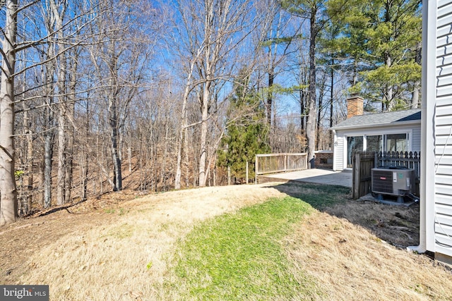 view of yard featuring central AC and a patio