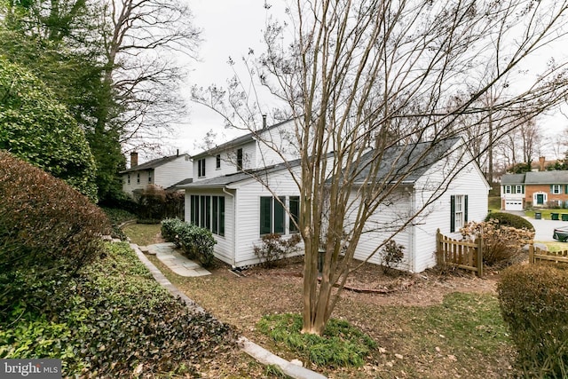 view of property exterior with fence