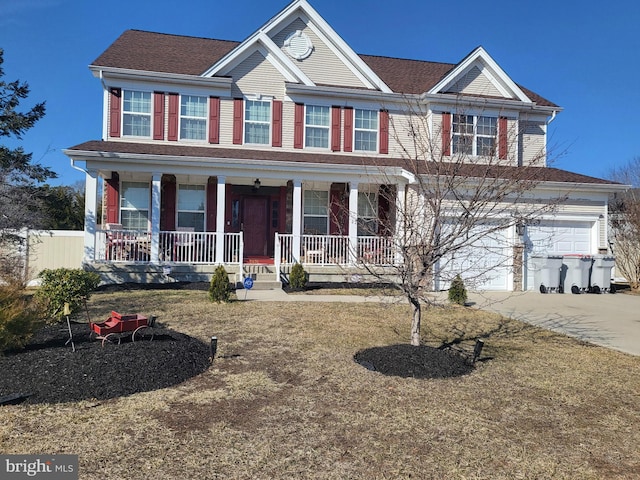 view of front of home featuring covered porch, concrete driveway, and an attached garage