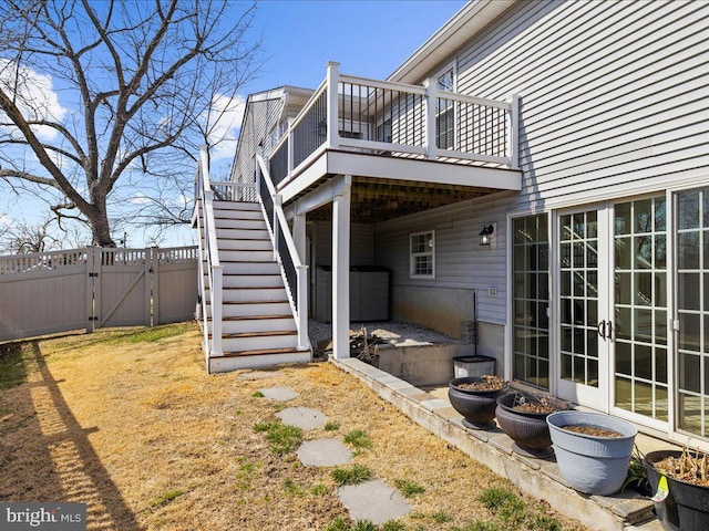 exterior space with fence, stairway, a wooden deck, french doors, and a gate