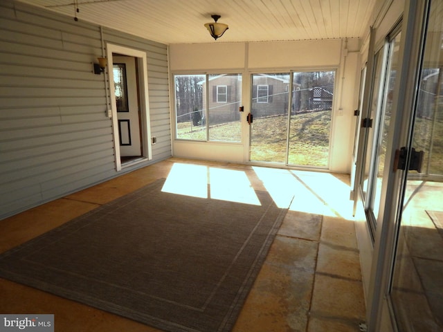 unfurnished sunroom featuring a healthy amount of sunlight