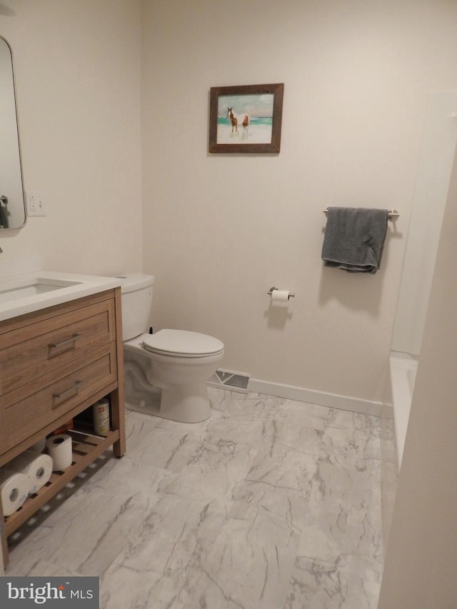 bathroom featuring marble finish floor, visible vents, toilet, vanity, and baseboards