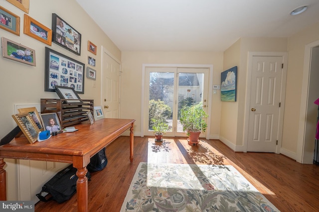 office featuring baseboards and wood finished floors