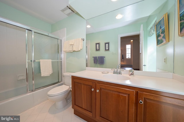 full bath with visible vents, toilet, enclosed tub / shower combo, tile patterned floors, and vanity