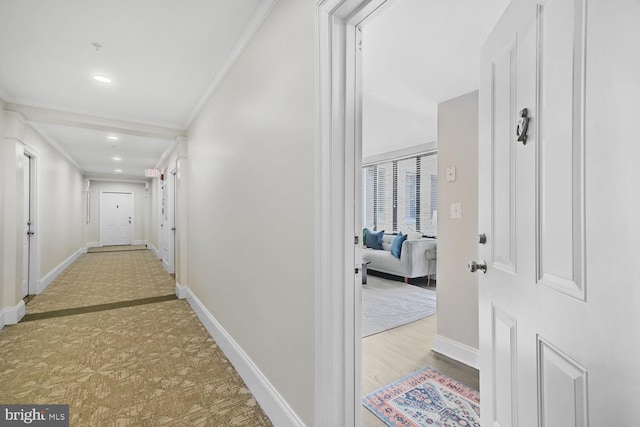 hallway with ornamental molding, recessed lighting, and baseboards