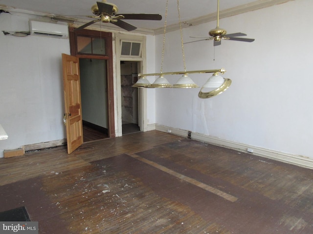 unfurnished room with an AC wall unit, hardwood / wood-style floors, a ceiling fan, and crown molding