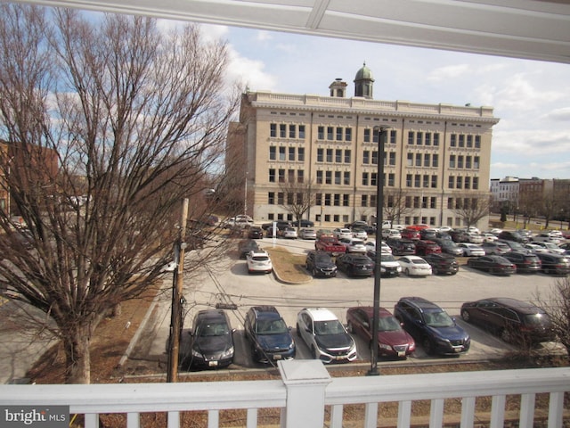 view of property with uncovered parking