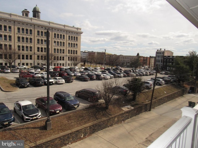 uncovered parking lot with a view of city