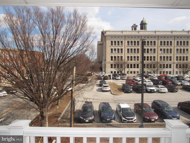 view of property with uncovered parking