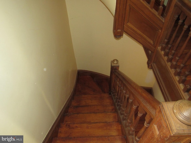 stairway featuring baseboards