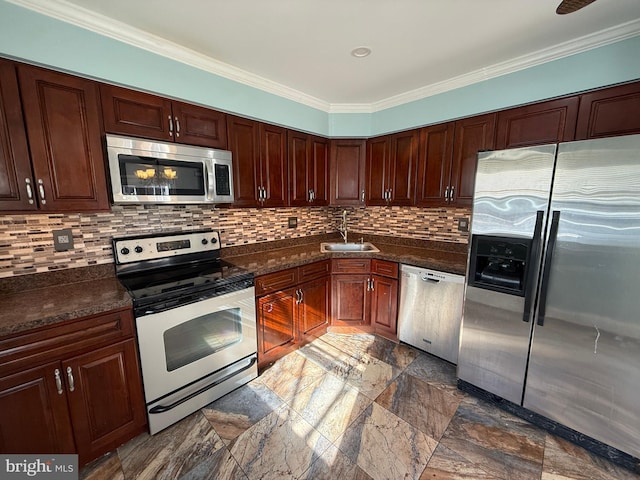 kitchen with appliances with stainless steel finishes, backsplash, a sink, and crown molding