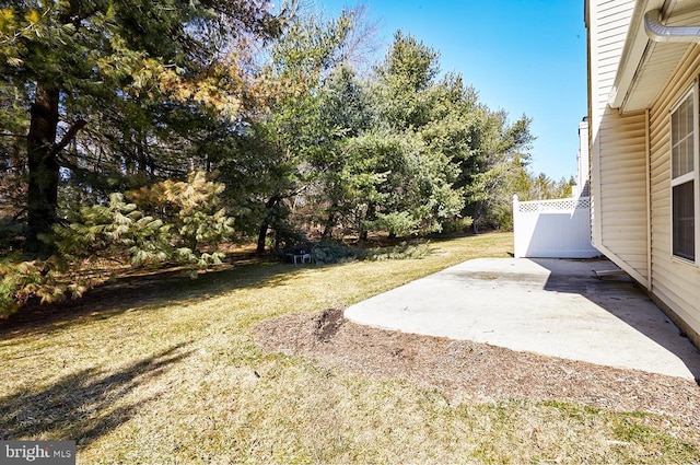 view of yard featuring a patio and fence