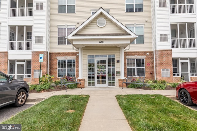 entrance to property with brick siding