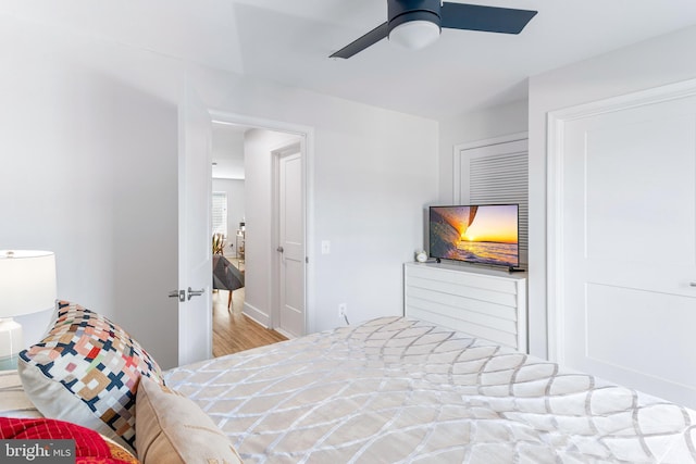 bedroom with ceiling fan and wood finished floors