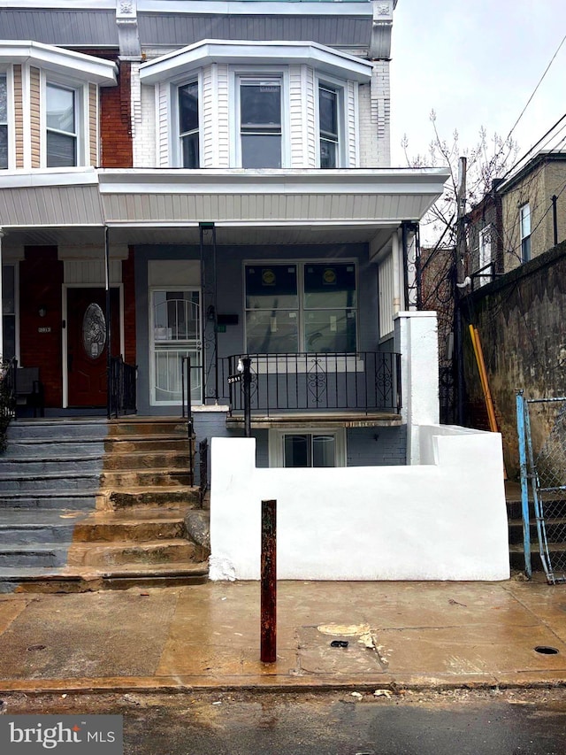 townhome / multi-family property with covered porch