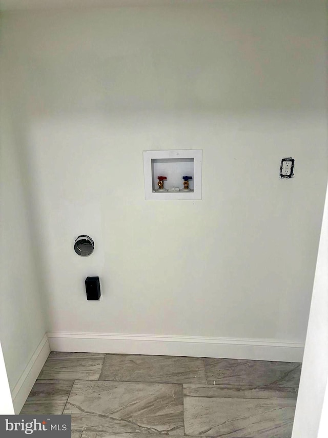 laundry area featuring hookup for a washing machine, baseboards, and laundry area