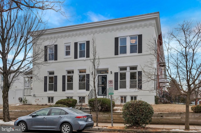 view of front of home featuring brick siding