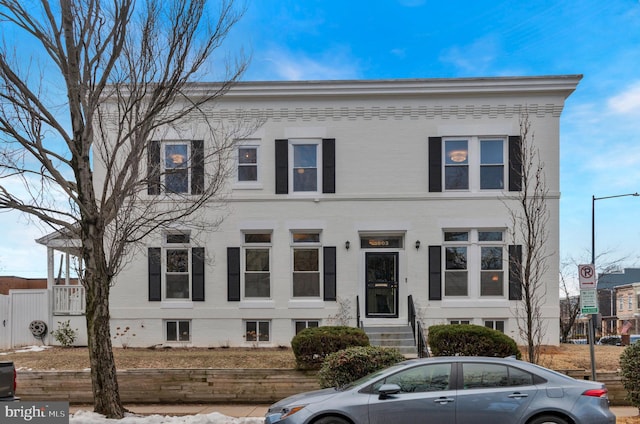 townhome / multi-family property with brick siding