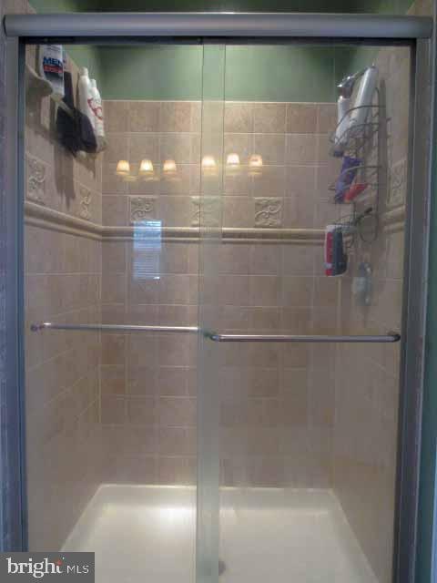 bathroom with a stall shower