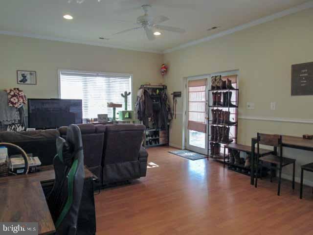 home office with recessed lighting, ornamental molding, a ceiling fan, and wood finished floors