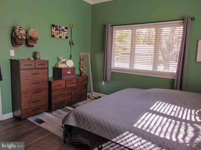 bedroom with wood finished floors