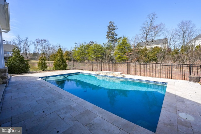 view of swimming pool with a fenced in pool, a fenced backyard, and a patio area