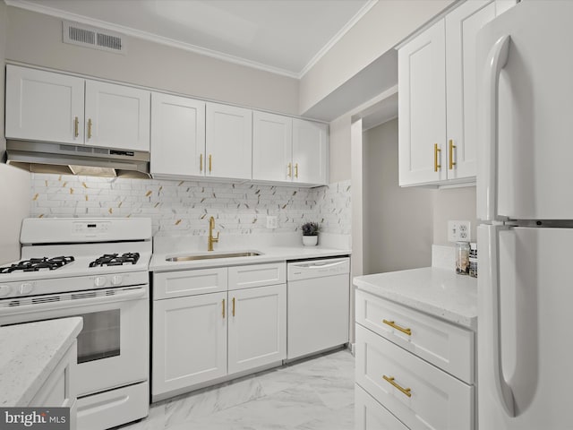 kitchen featuring visible vents, under cabinet range hood, ornamental molding, white appliances, and a sink