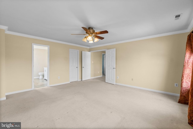 unfurnished bedroom featuring baseboards, light carpet, and crown molding