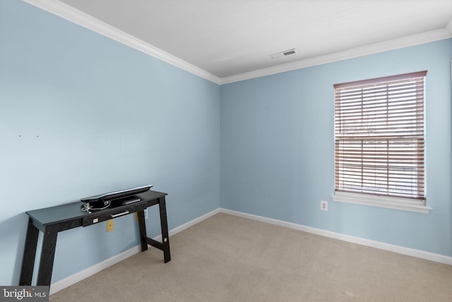 unfurnished room featuring ornamental molding, visible vents, a wealth of natural light, and carpet floors