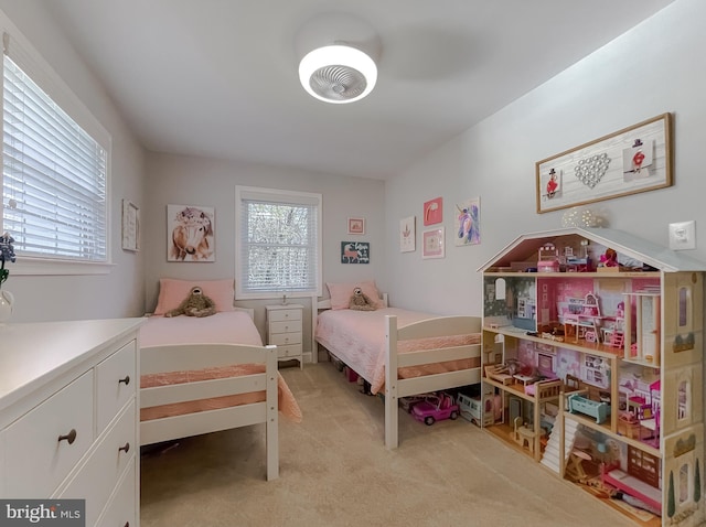 bedroom featuring light carpet