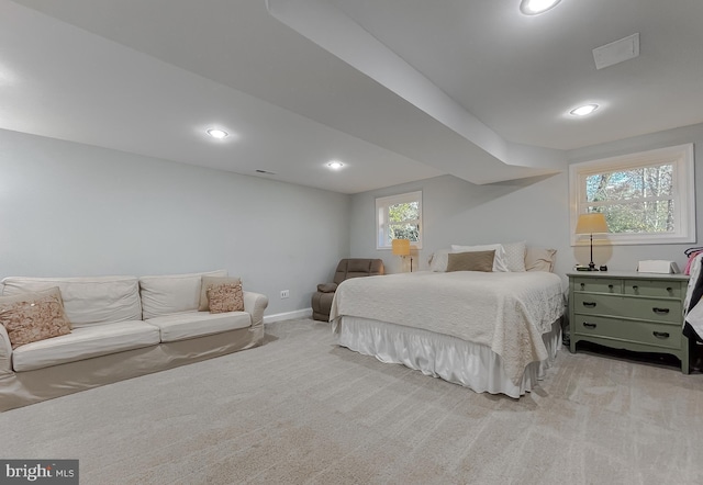 bedroom featuring baseboards, recessed lighting, visible vents, and light colored carpet